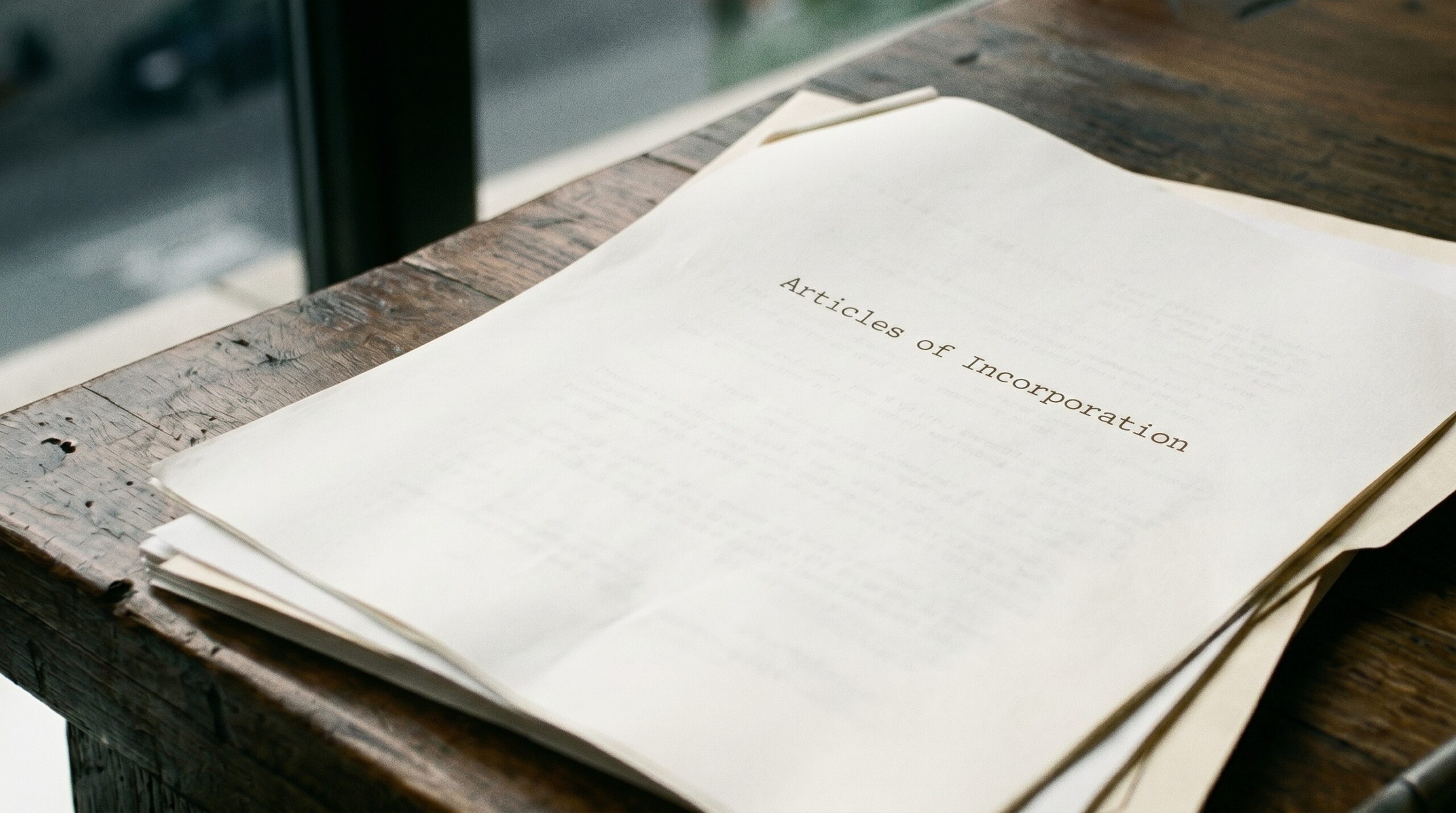 Close-up of articles of incorporation on a desk representing Florida corporations bar exam topics and corporate formation rules