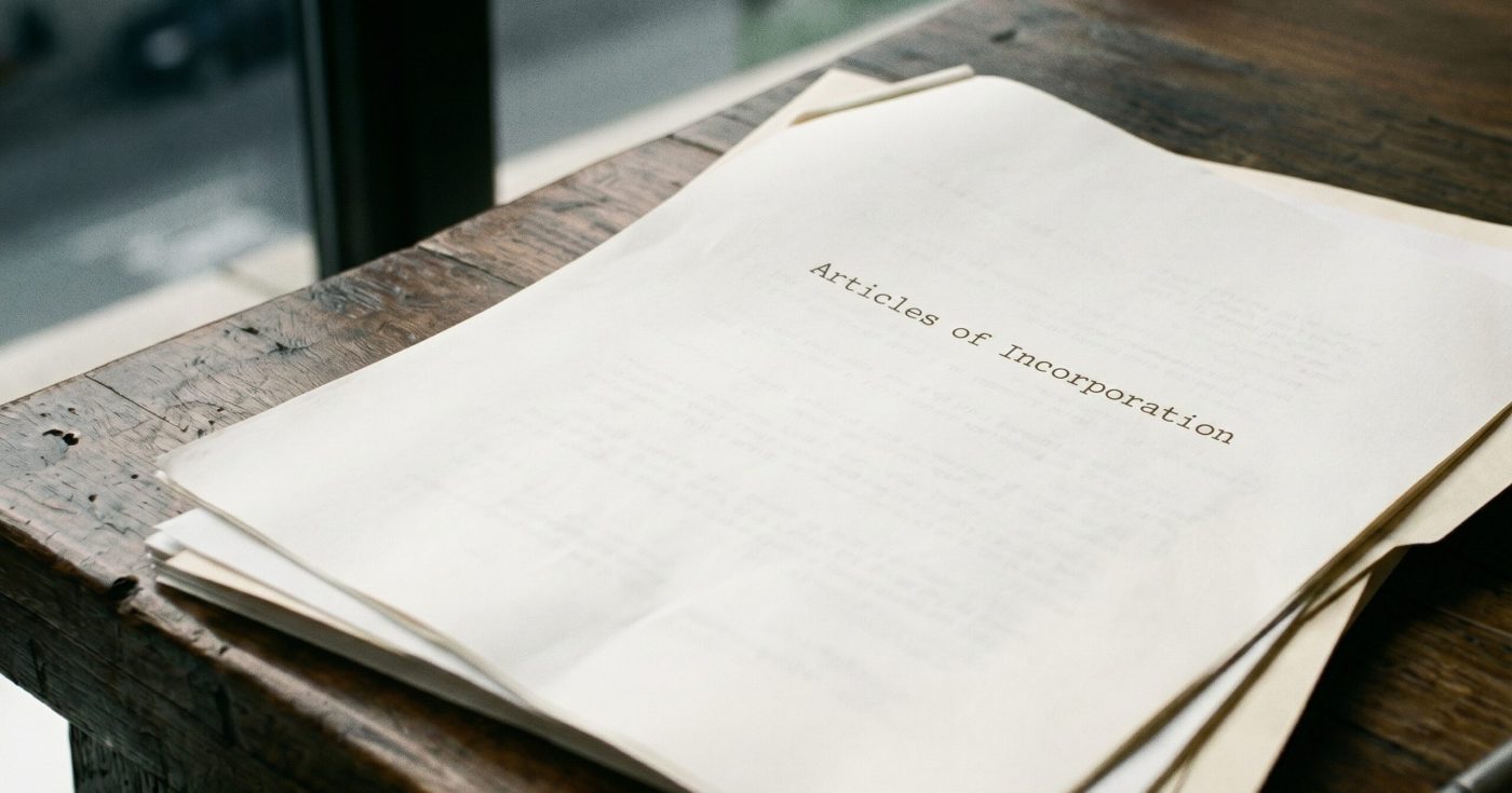 Close-up of articles of incorporation on a desk representing Florida corporations bar exam topics and corporate formation rules